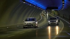 Eurasia Tunnel in Istanbul, cars passing through it at night, blue lights burning inside
