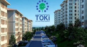 شعار توكي عبارة عن عبارة توكي فوقها شجرة خضراء ونقاط زرقاء دائرية على صورة أحد مشاريع الشركة