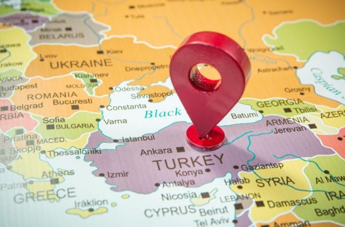 The world map and a reference to the country of Türkiye are red