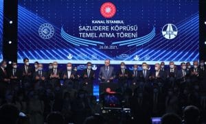 Turkish President Recep Tayyip Erdogan lays the foundation stone for the first bridge of the Istanbul Canal in the presence of a group of officials