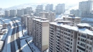Toki's buildings overlook the street directly and are covered in white snow
